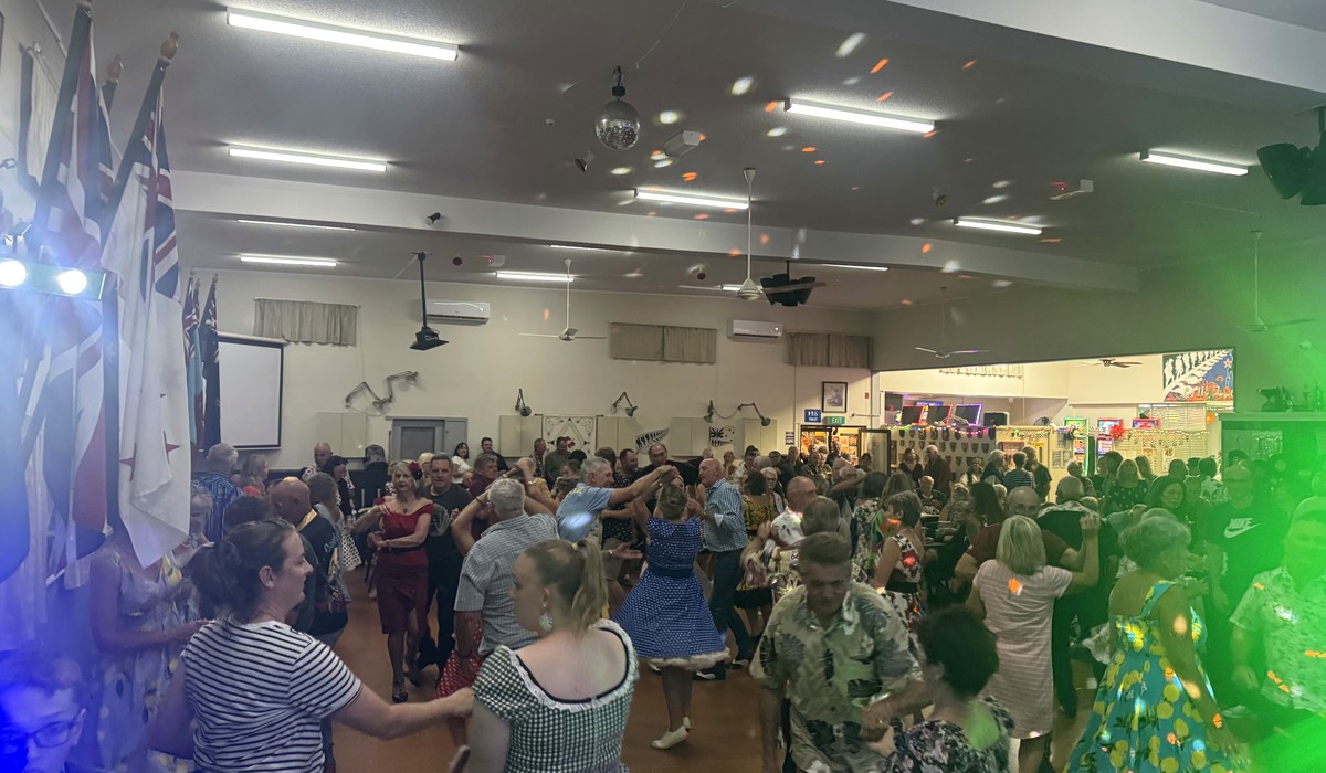 Packed dance floor at Beach Hop 2025 during a Blaze Rock 'n' Roll performance