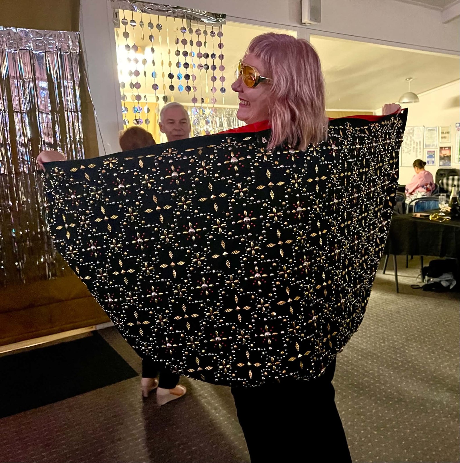 The back of a rhinestone-studded Elvis cape worn by a fan at the show