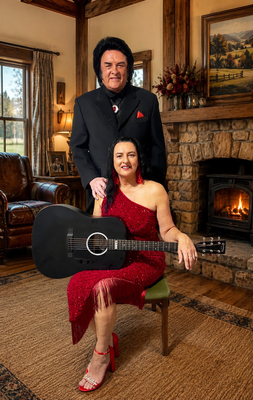 Trevor Needham and Jannine Douglas as Johnny Cash and June Carter by a warm fireside with acoustic guitar