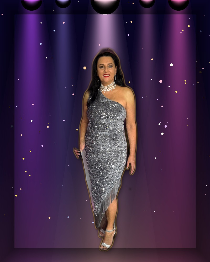 Show Co-Host performing as Jannine Douglas in the Legends Live Variety Show