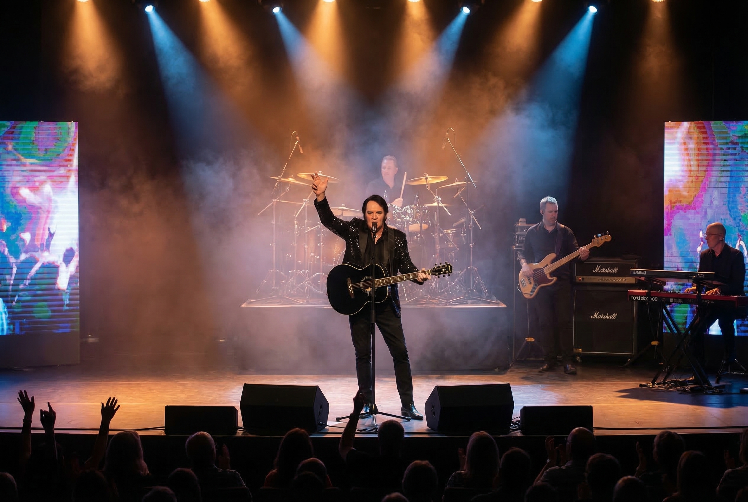 Trevor Needham performing on stage as Neil Diamond