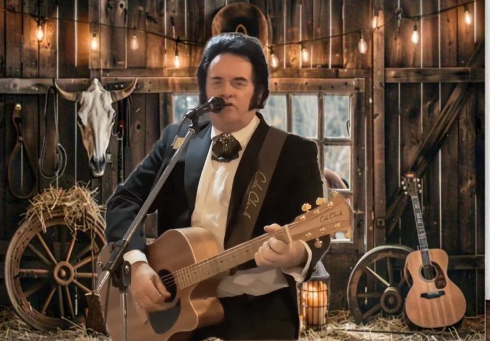 Trevor Needham performing as Johnny Cash with acoustic guitar in a rustic barn setting